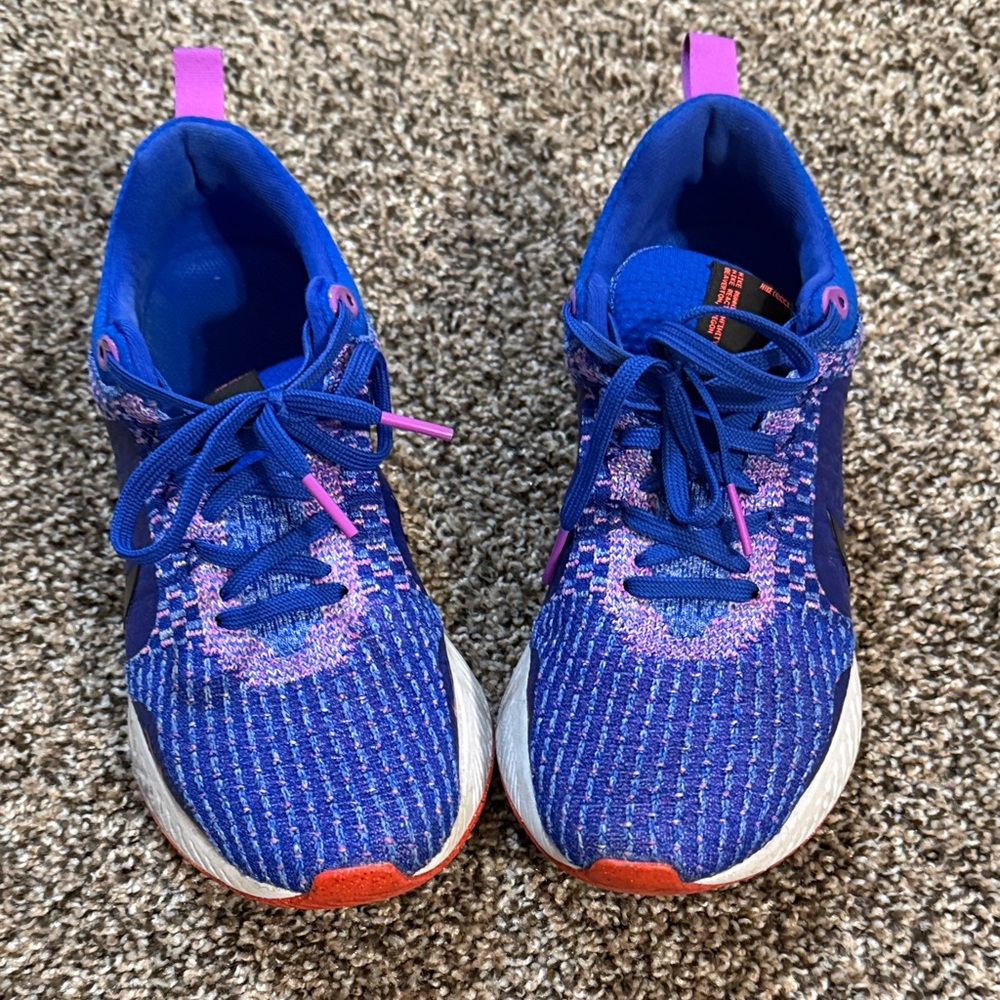 Women’s Blue and Pink Nike react sneakers